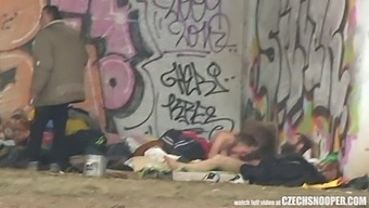 A Threesome Of Homeless Individuals Engage In Sexual Activity In A Public Setting, Captured By A Czech Snooper