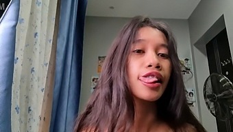 A Petite Asian Woman With A Slender Build